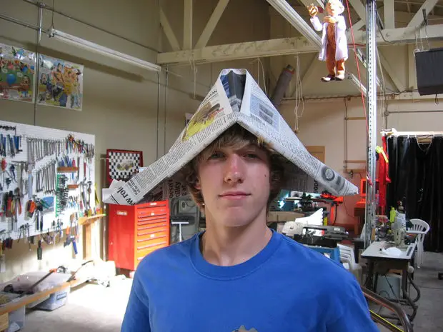 How to Make a Newspaper Hat for Adults